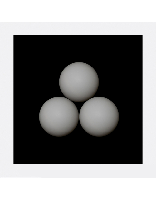 Three White Spheres on a Black Square